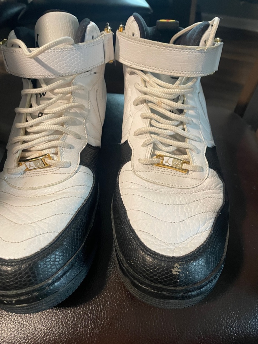 Jordan White and Black High-Top Sneakers with Gold Accents